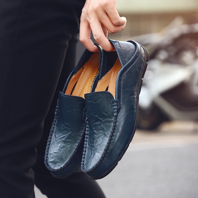 Slip-on-driving-moccasins-blue-in-hand